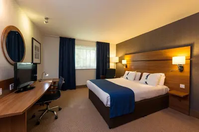 a hotel room with a bed and a desk at Holiday Inn Express Shrewsbury by IHG in Shrewsbury