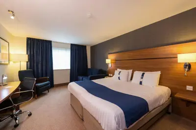 a hotel room with a bed and a desk at Holiday Inn Express Shrewsbury by IHG in Shrewsbury