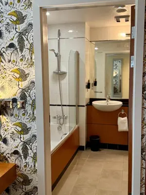 a bathroom with a shower and a sink at Wild Pheasant Hotel & Spa in Llangollen