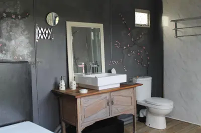 a bathroom with a sink and a toilet at Off the Rails in Oswestry