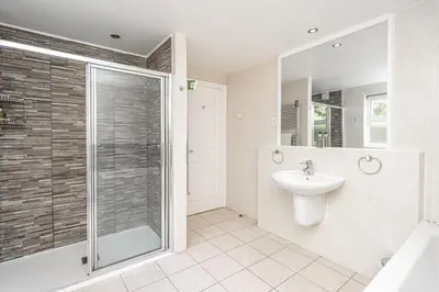a bathroom with a shower and a sink at Penhelig Arms in Aberdyfi