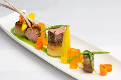 a plate of food with meat and vegetables on it at Prince Rupert Hotel in Shrewsbury