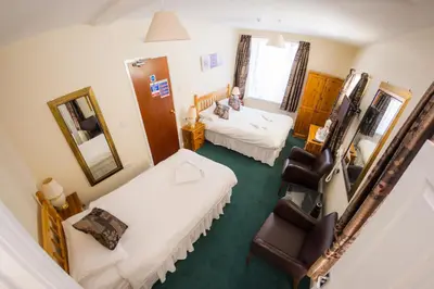an overhead view of a room with two beds at Queensbridge Hotel in Aberystwyth