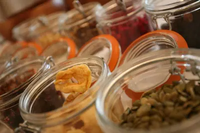 a bunch of glass jars filled with food on a table at Fishmore Hall Hotel and Boutique Spa in Ludlow
