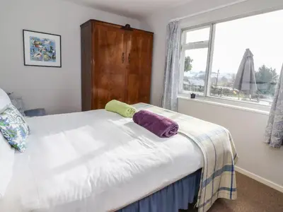 a bed with two pillows on it in a bedroom at Dolau Meurig in Ystrad Meurig