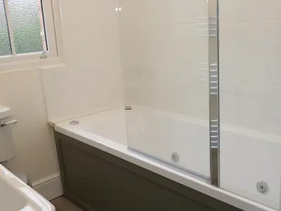 a shower with a glass door in a bathroom at 7 Monkmoor Road in Shrewsbury