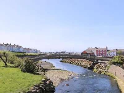 a bridge over a river in a city at Blaenywawr in Cross Inn