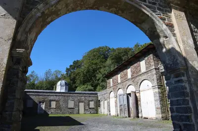 an archway leading into a brick building with a dome at Plas Nanteos Mansion in Aberystwyth