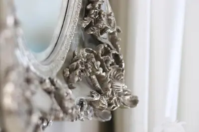 a close up of a mirror with a flower on it at Plas Nanteos Mansion in Aberystwyth