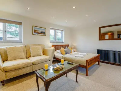 a living room with a couch and a coffee table at Pant Dafydd Goch in Glyn-Ceiriog