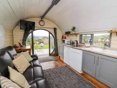 a kitchen and living room in a tiny house at Mountain View in Saint Harmon