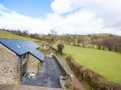 an aerial view of a house with a solar roof at 2 Bed in Machynlleth oc-bow39 in Darowen
