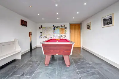 a room with a pool table in the middle at 5 Bed in Machynlleth oc-bow30 in Darowen
