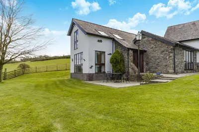 a house with a grassy yard in front of it at 2 Bed in Caersws oc-waa322 in Trefeglwys