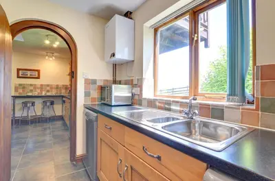 a kitchen with a sink and a window at 2 Bed in Caersws oc-waa322 in Trefeglwys