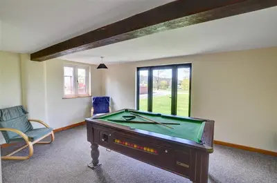 a room with a pool table and a chair at 2 Bed in Llandinam oc-waa377 in Llandinam