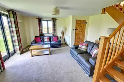 a living room with a couch and a table at 2 Bed in Llandinam oc-waa377 in Llandinam