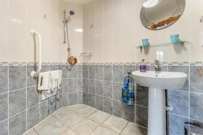 a bathroom with a sink and a mirror at 4 Bed in Caersws oc-waa321 in Trefeglwys