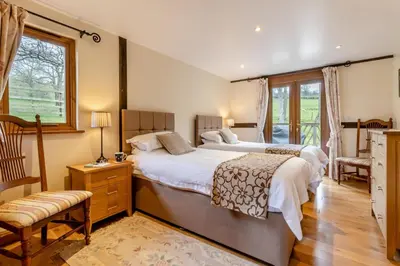 a large bedroom with two beds and a window at 2 Bed in Caersws oc-waa345 in Trefeglwys