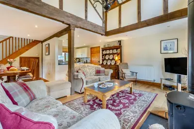 a living room with a couch and a table at 2 Bed in Caersws oc-waa345 in Trefeglwys