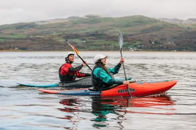 two people in kayaks on a body of water at 3 Bed in Dolgellau oc-wah605 in Rhydymain