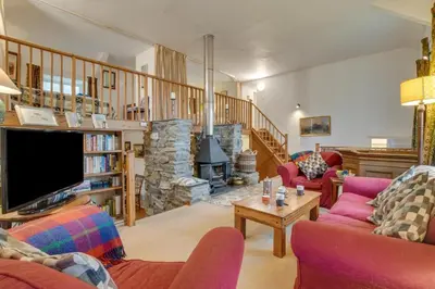 a living room with two couches and a tv at 3 Bed in Dolgellau oc-wah484 in Llanfachreth