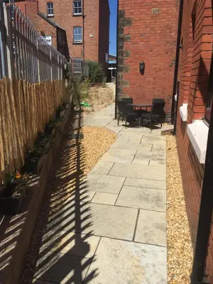 a shadow of a fence and a patio at Victorian Church Flat 3 in Oswestry