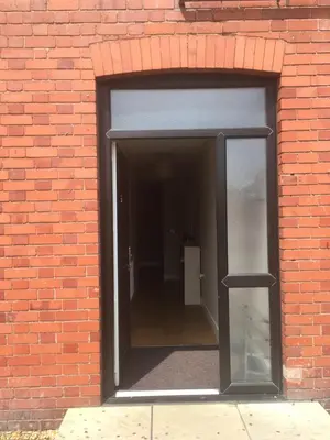 an open door in a brick wall at Victorian Church Flat 3 in Oswestry