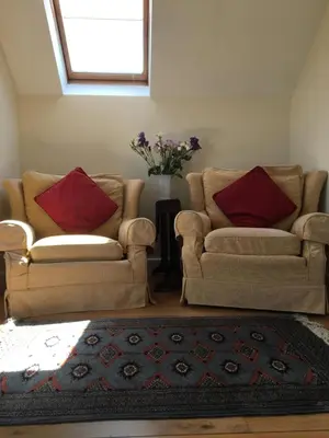 a living room with two couches and a rug at The View in Welshpool