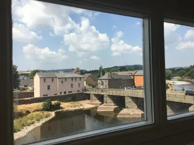 a view of a bridge from a window at Riverside in Brecon