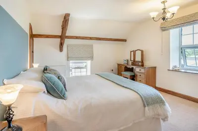 a bedroom with a white bed and a window at 1 Bed in Nantygwreiddyn oc-bow49 in Sennybridge