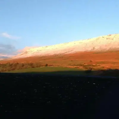 a view of a hill with a green field at The House In The Hills in Velindre