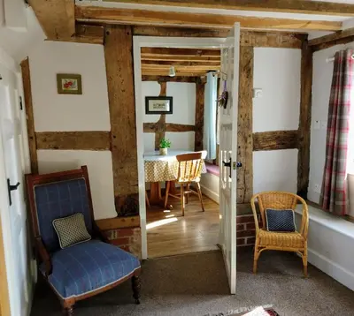 a room with a table and two chairs and a table at Little Drift in Edgton