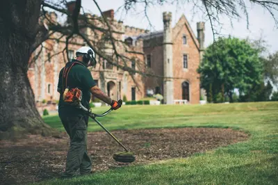 a man holding a golf club in front of a building at Rowton Castle in Shrewsbury