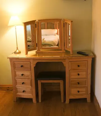 a wooden desk with a mirror on top of it at Henllys Estate B and B in Llandovery