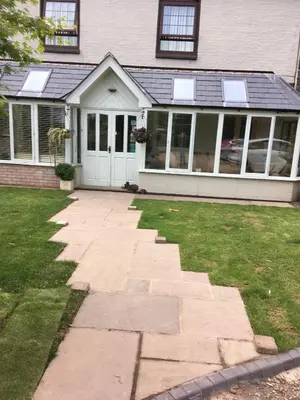 a house with a stone walkway in front of a house at Henwick house accommodation, Continental breakfast included in Ludlow