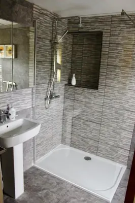 a bathroom with a tub and a sink and a shower at Winforton B&B in Winforton