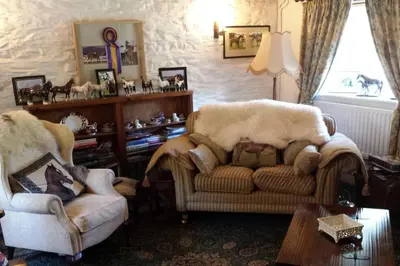 a living room with two chairs and a couch at Canol y Llan in Machynlleth
