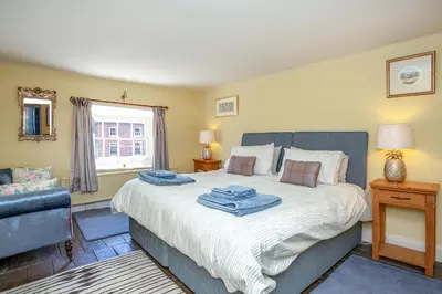a bedroom with a bed with towels on it at Colomendy in Montgomery
