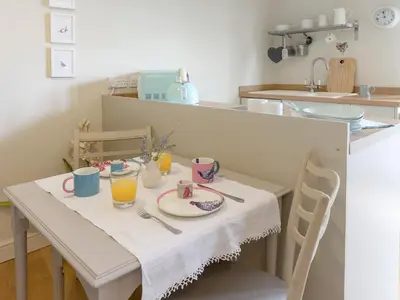 a table with a plate of food and drinks on it at Mortimer Trail Mews in Aymestrey