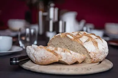 a loaf of bread on a plate on a table at The Hall in Bucknell