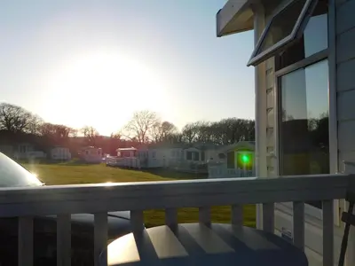 a balcony with a view of a yard at Dyfed 23 in Borth