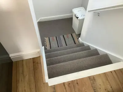 a stairway in a room with a stair case at 2 Yr Hen Fanc in Aberaeron