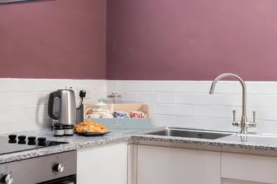 a kitchen with a sink and a counter top at The Hayloft, Wall End Farm in Leominster