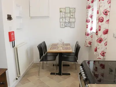 a dining room with a table and chairs at The Hayloft in Shelve