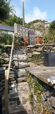 a set of stone stairs leading to a house at Penbryn Holidays No 2 in Barmouth