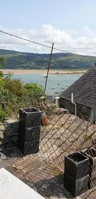 a view of a body of water from a house at Penbryn Holidays No 2 in Barmouth
