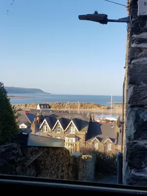 a view of a group of houses and the ocean at Penbryn Holidays No 2 in Barmouth