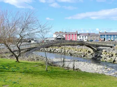a bridge over a river in a city at Ty Bach Twt in Llangeitho
