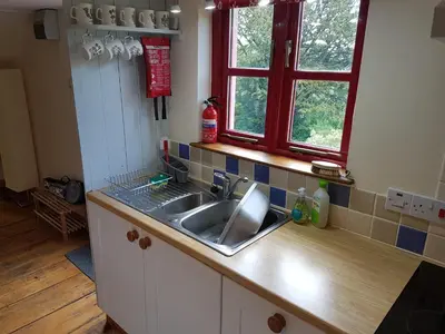 a kitchen with a sink and a window at Seren Loft - Cynghordy, Llandovery in Llandovery